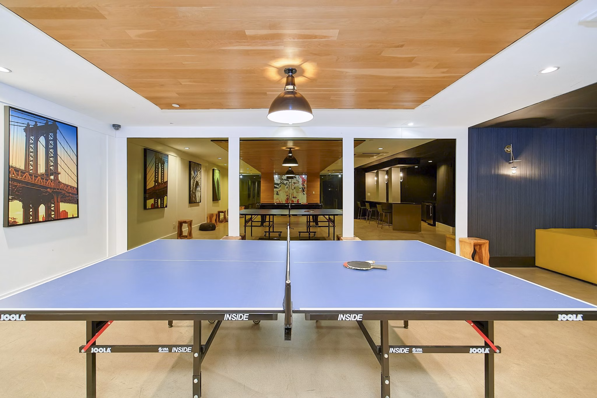 Clubhouse game room with billiards table at 1209 Dekalb Apartments featuring stylish decor and ample seating for relaxation and socializing