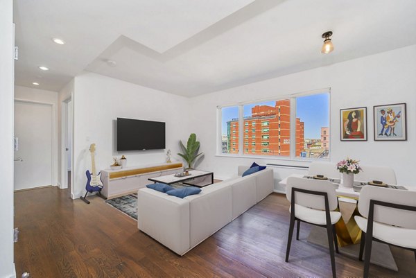 Living room with modern furnishings in 1209 Dekalb Apartments, Greystar luxury apartments