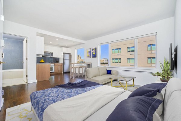 Studio living room with modern furnishings and bright decor at 1209 Dekalb Apartments, luxury apartments by Greystar in Brooklyn