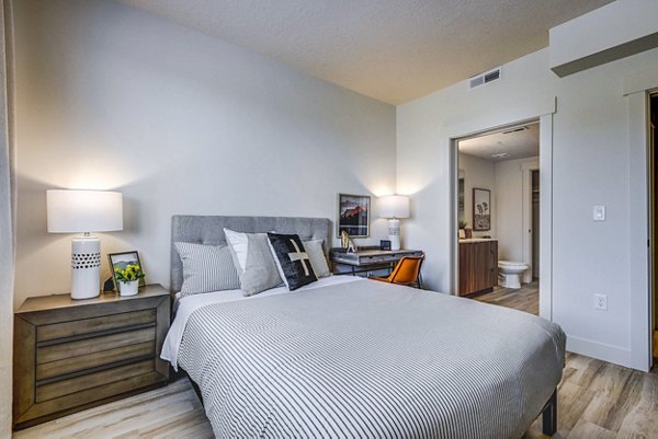 Bedroom featuring contemporary decor and sleek furnishings at Bravada 193 luxury apartments