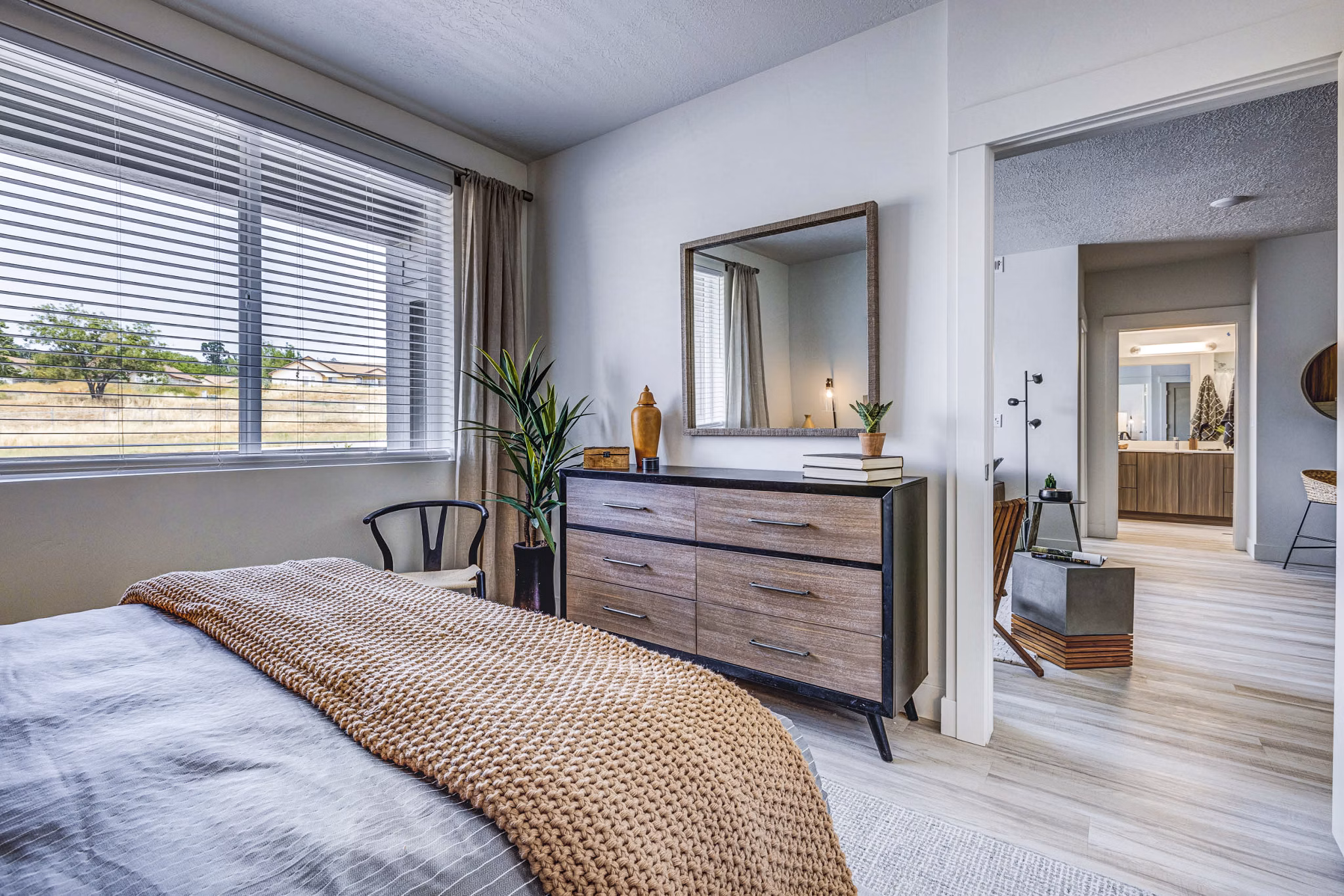 Bedroom featuring modern furniture and stylish decor at Bravada 193 Apartments