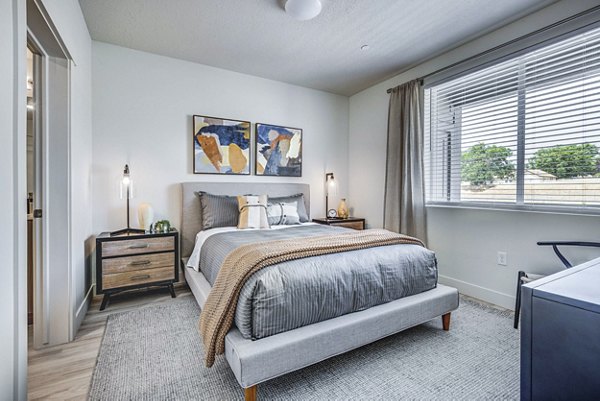 Cozy bedroom with modern decor in Bravada 193 Apartments