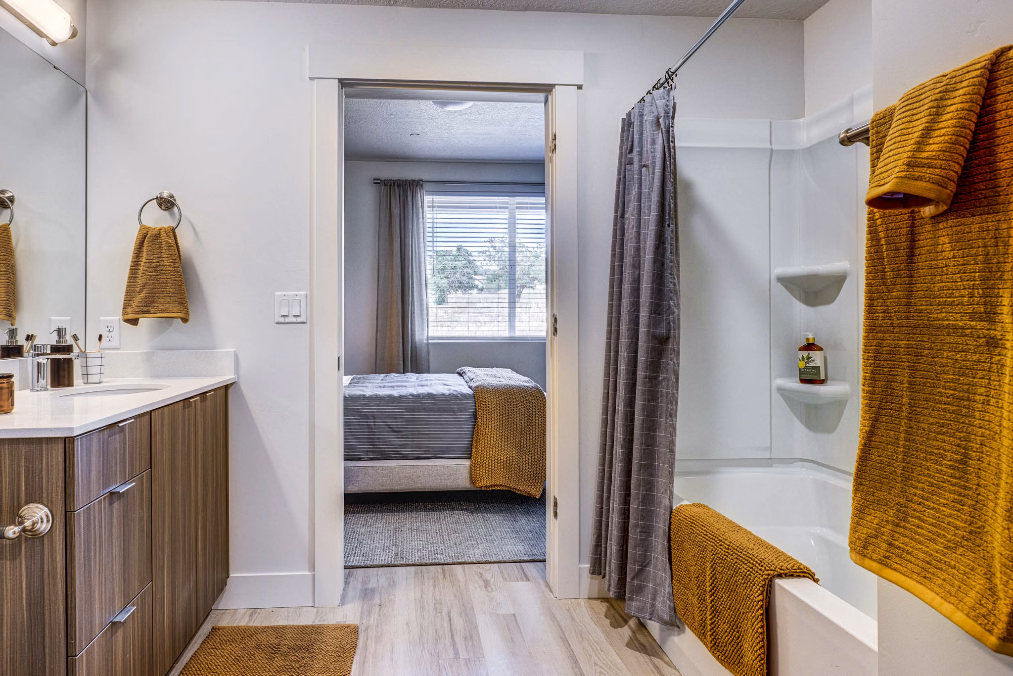 Luxurious bathroom featuring marble countertops and modern fixtures at Bravada 193 Apartments