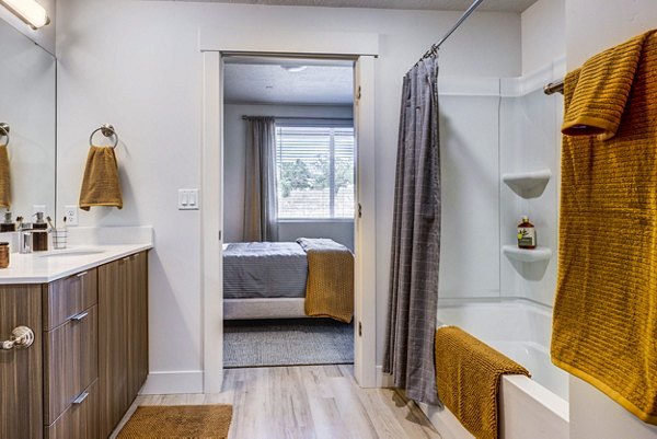 Luxurious bathroom featuring marble countertops and modern fixtures at Bravada 193 Apartments