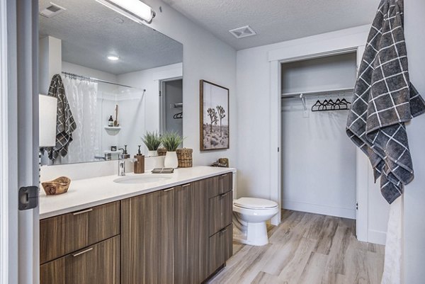 Bathroom featuring sleek marble countertops at Bravada 193 Apartments