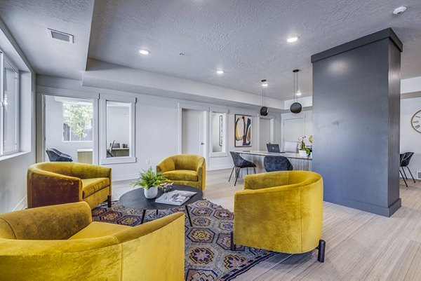 Clubhouse lounge with modern decor and seating at Bravada 193 Apartments