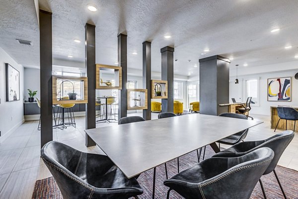 Clubhouse lobby with modern seating and art in Bravada 193 Apartments