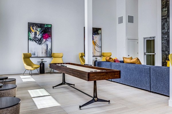 Clubhouse lobby featuring modern design and seating areas at Bravada 193 Apartments