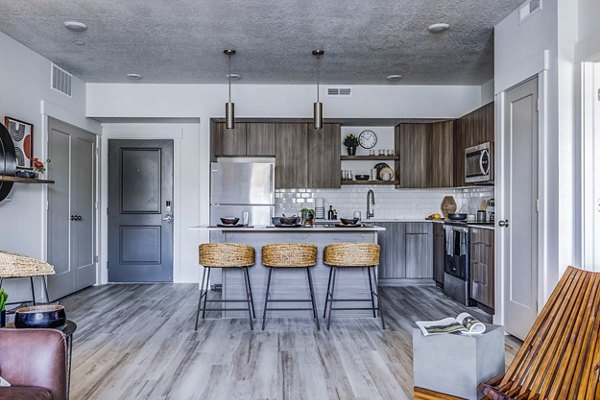 Modern kitchen with stainless steel appliances in Bravada 193 Apartments