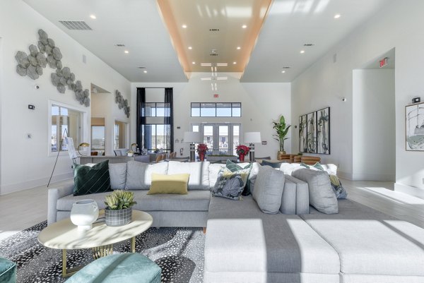 Elegant clubhouse with contemporary furnishings at Moderno Apartments, perfect for social gatherings and community events