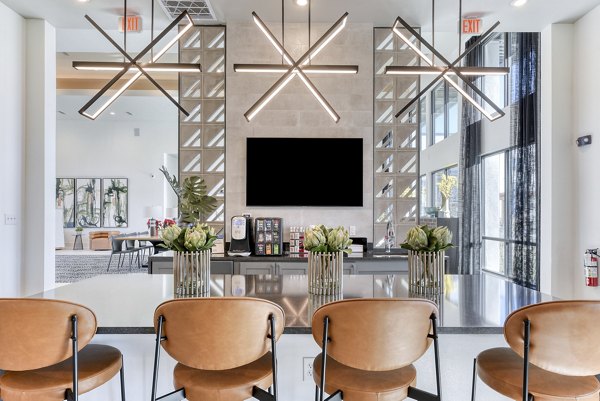 Stylish clubhouse with modern decor at Moderno Apartments, ideal for social gatherings and community events