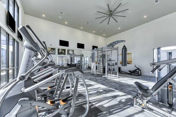 State-of-the-art fitness center equipped with cardio machines at Moderno Apartments