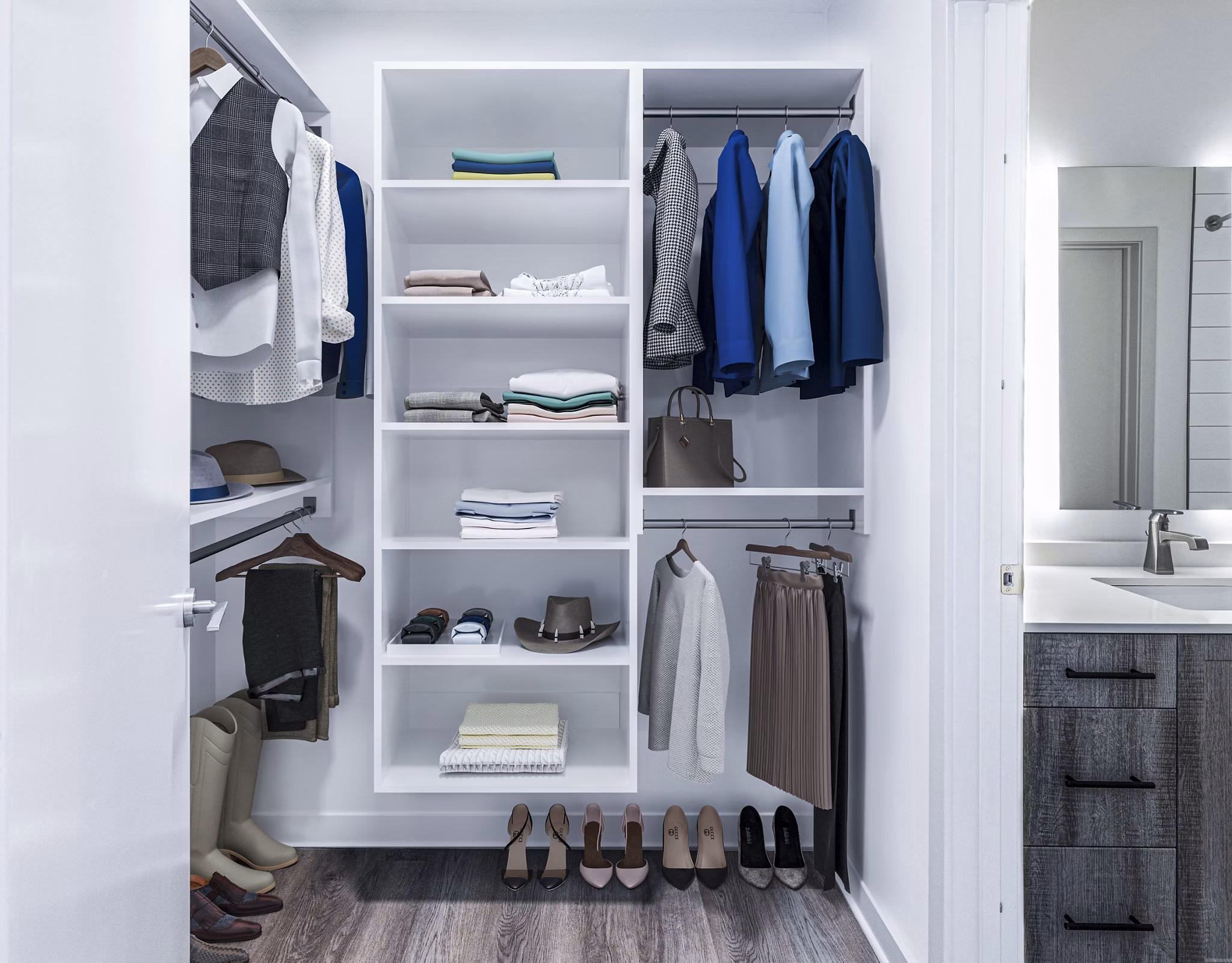 Bedroom closet with custom shelving at Fallyn Apartments: Luxury storage solutions in spacious Greystar community