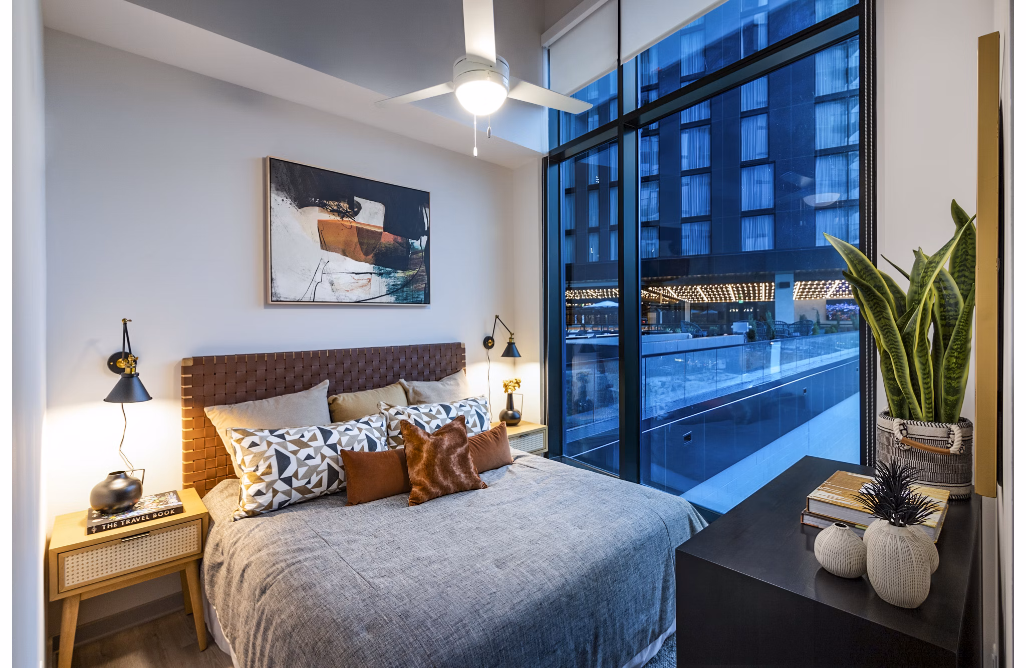 Cozy bedroom with modern decor at Fallyn Apartments, offering luxury living spaces and premium amenities in a prime location