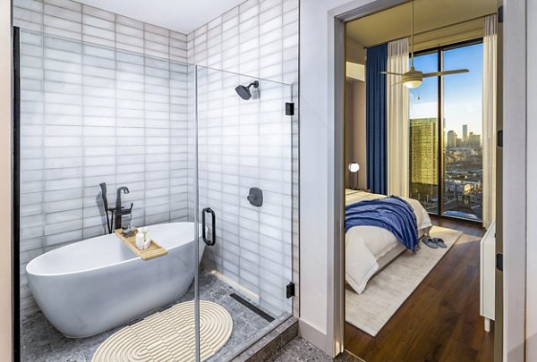 Contemporary bathroom with dual sinks in Fallyn Apartments