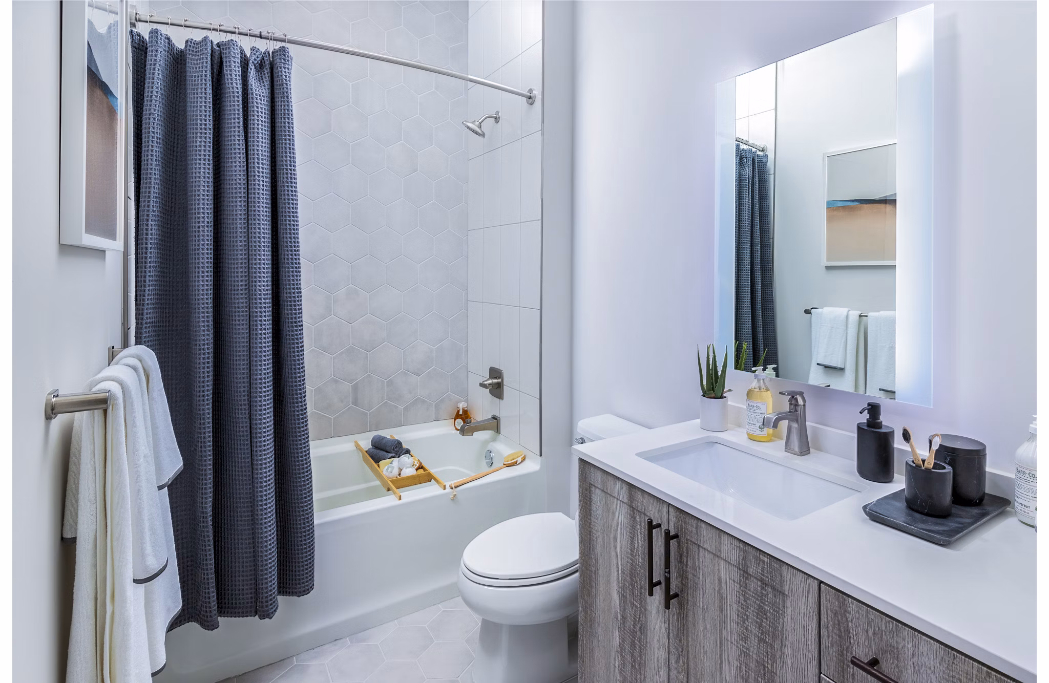 Modern bathroom with sleek fixtures at Fallyn Apartments offering luxury living near shopping and dining