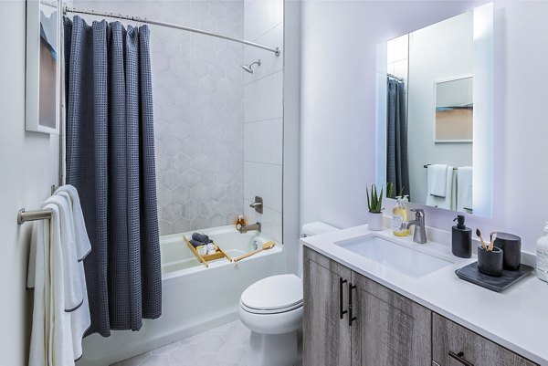 Modern bathroom with sleek fixtures at Fallyn Apartments offering luxury living near shopping and dining