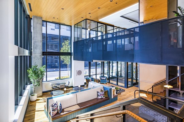 Elegant clubhouse lobby with sleek modern design at Fallyn Apartments, offering a luxurious setting for residents to relax and socialize
