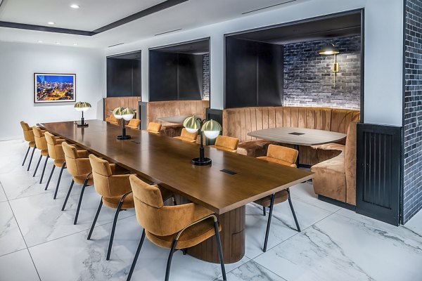 Modern clubhouse at Fallyn Apartments offering a sleek design with comfortable seating and expansive views in a vibrant community setting