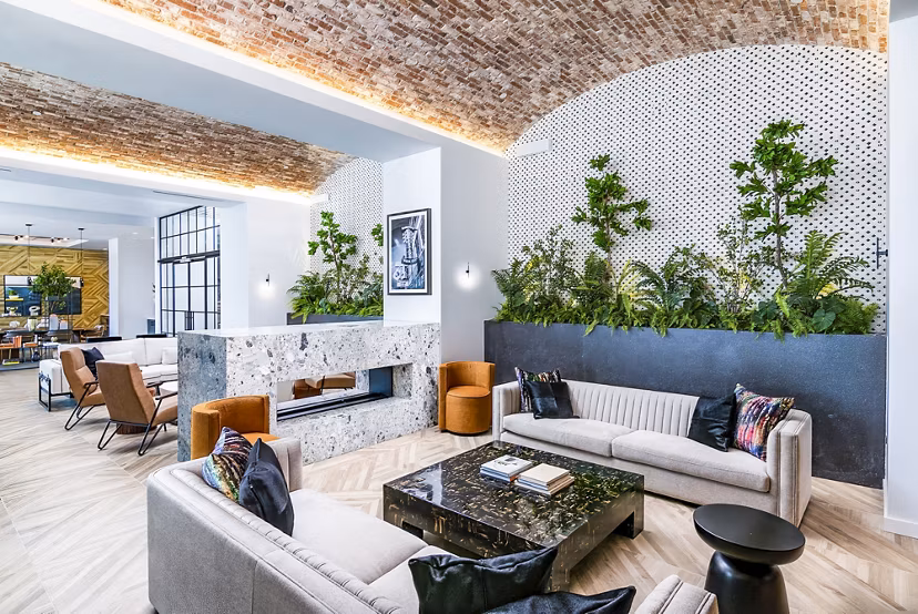 Modern clubhouse featuring plush seating and sleek design at Fallyn Apartments