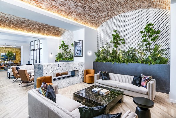 Modern clubhouse featuring plush seating and sleek design at Fallyn Apartments