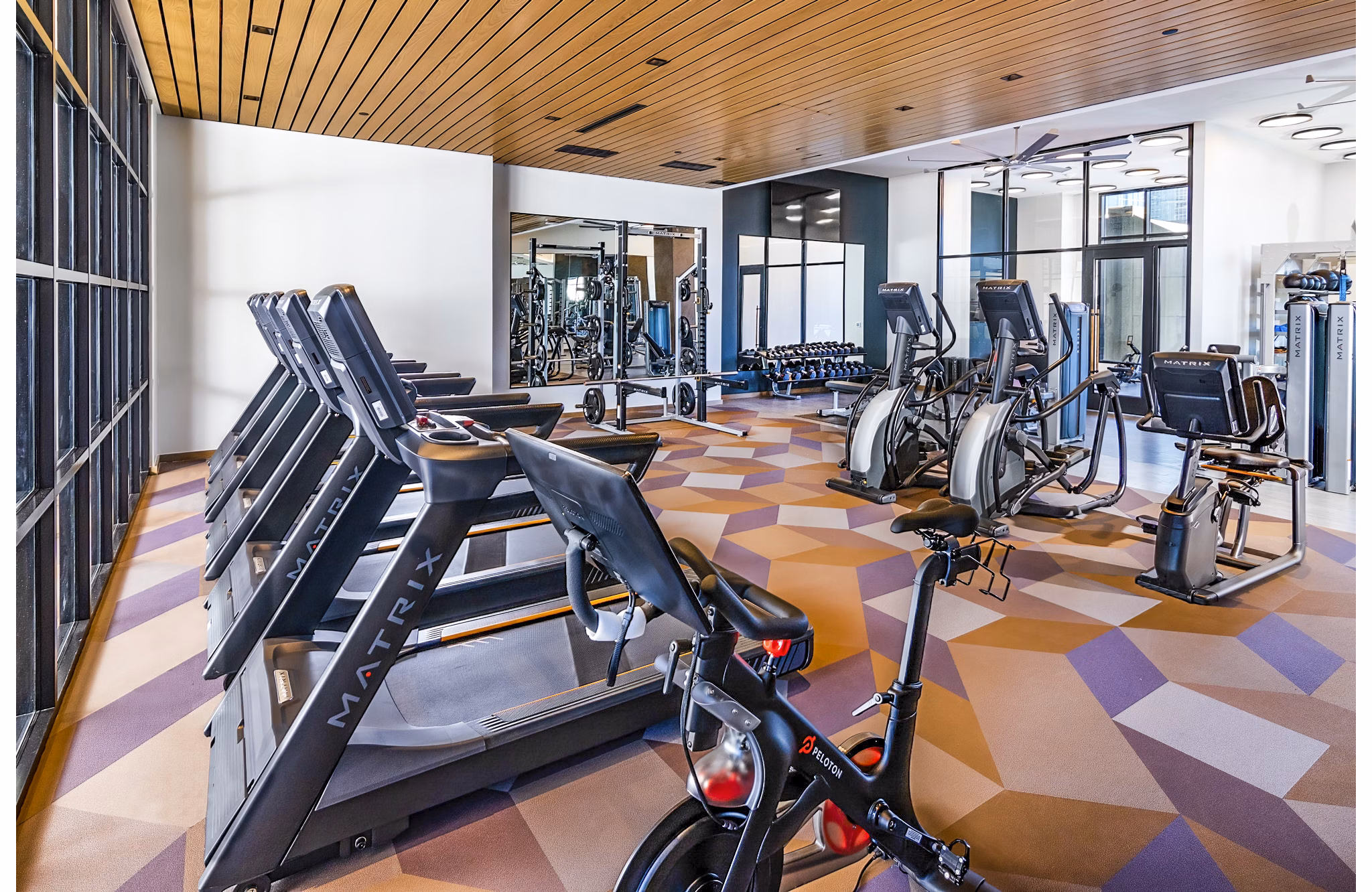State-of-the-art fitness center at Fallyn Apartments with modern equipment and spacious workout areas