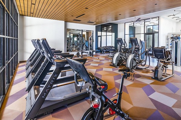 State-of-the-art fitness center at Fallyn Apartments with modern equipment and spacious workout areas