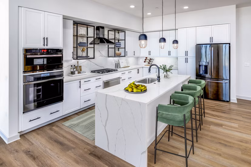 Modern kitchen featuring stainless steel appliances and elegant cabinetry in Fallyn Apartments Ideal for luxury living and culinary enthusiasts