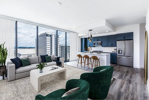 Spacious living room with modern decor in Fallyn Apartments featuring luxury amenities