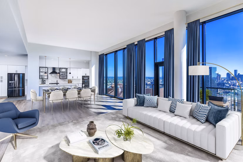Spacious living room with contemporary furnishings in Fallyn Apartments, Greystar luxury apartments in vibrant cityscape