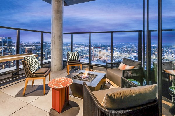 Private balcony with modern furniture at Fallyn Apartments