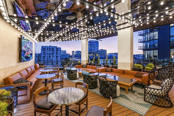 Spacious balcony with stunning views at Fallyn Apartments, perfect for outdoor relaxation and cityscape enjoyment