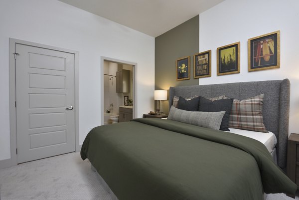 Cozy bedroom with stylish decor at The Flats at West Alabama Apartments