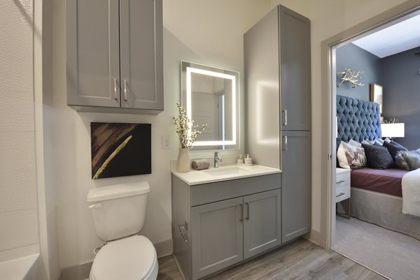 Luxurious bathroom with modern fixtures at The Flats at West Alabama Apartments in Houston