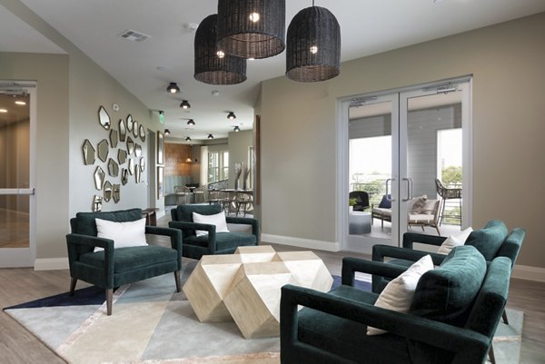 Clubhouse boasting modern design and ample seating at The Flats at West Alabama Apartments