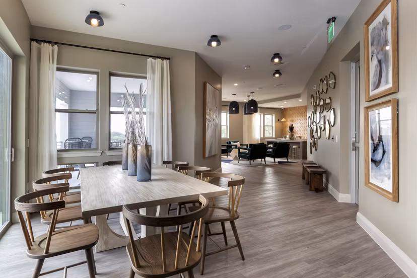 Clubhouse featuring modern seating and entertainment area at The Flats at West Alabama Apartments, Houston