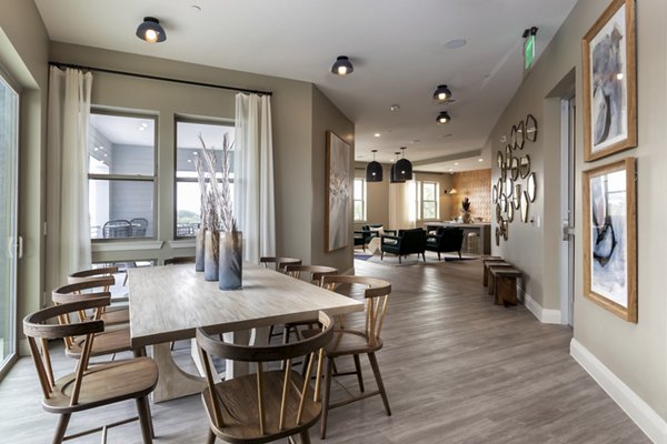 Clubhouse featuring modern seating and entertainment area at The Flats at West Alabama Apartments, Houston