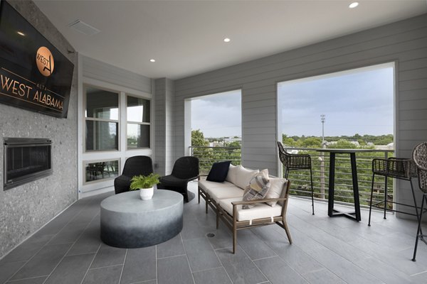 Clubhouse featuring modern design and comfortable seating at The Flats at West Alabama Apartments