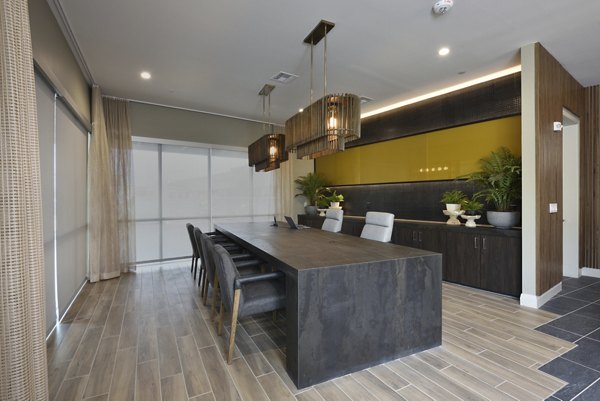 Clubhouse with stylish seating and vibrant decor at The Flats at West Alabama Apartments, perfect for luxury living and community events