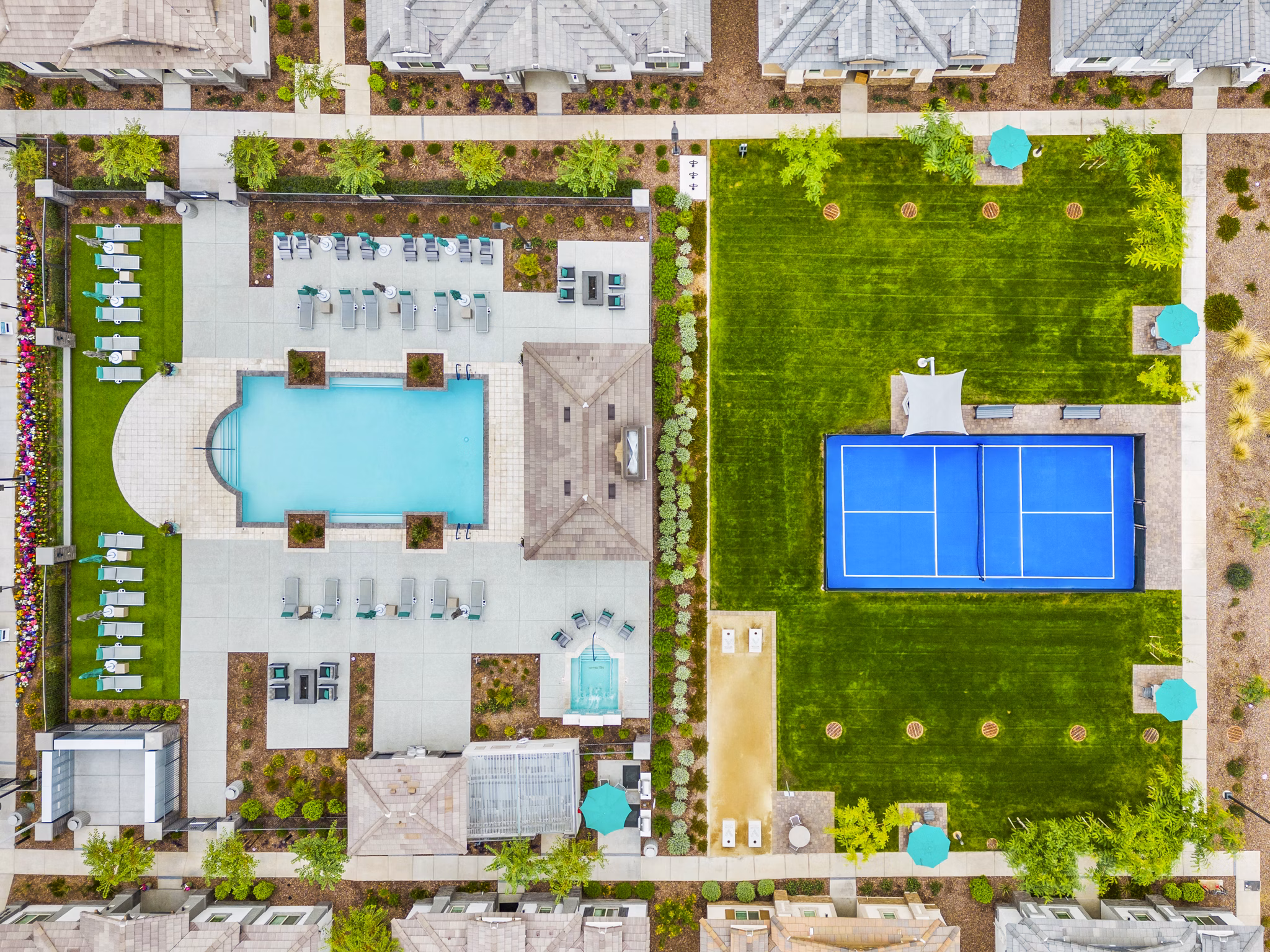Luxury pool and tennis court at Vlux at Peoria Heights Apartments offering premium recreational facilities for residents