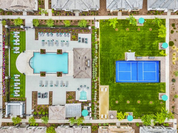Luxury pool and tennis court at Vlux at Peoria Heights Apartments offering premium recreational facilities for residents