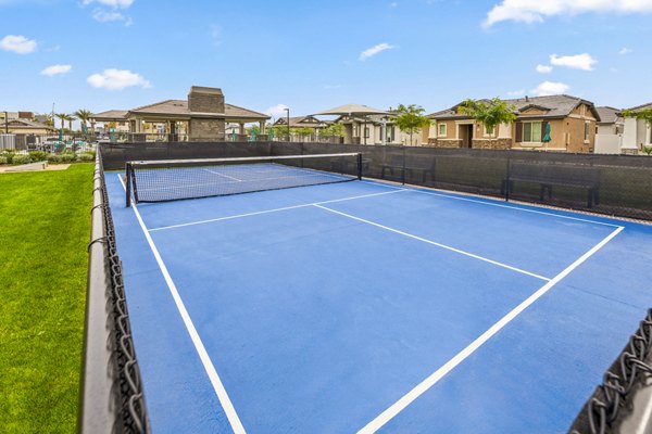 Modern tennis court at Vlux at Peoria Heights Apartments offers recreational opportunities for residents