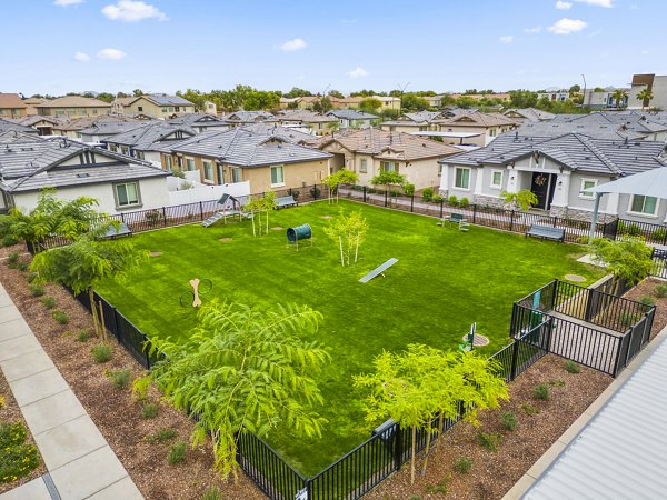 Dog park with agility equipment at Vlux at Peoria Heights Apartments offering amenities for pet owners