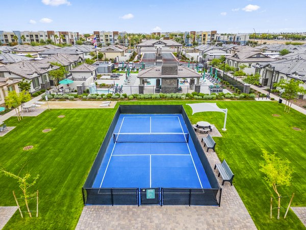 Tennis court at Vlux at Peoria Heights: Modern outdoor sports facility for residents' active lifestyle