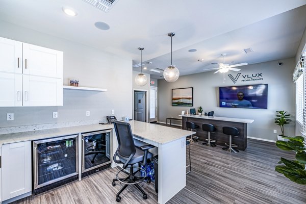 Spacious clubhouse lobby featuring modern decor at Vlux at Queen Creek Apartments