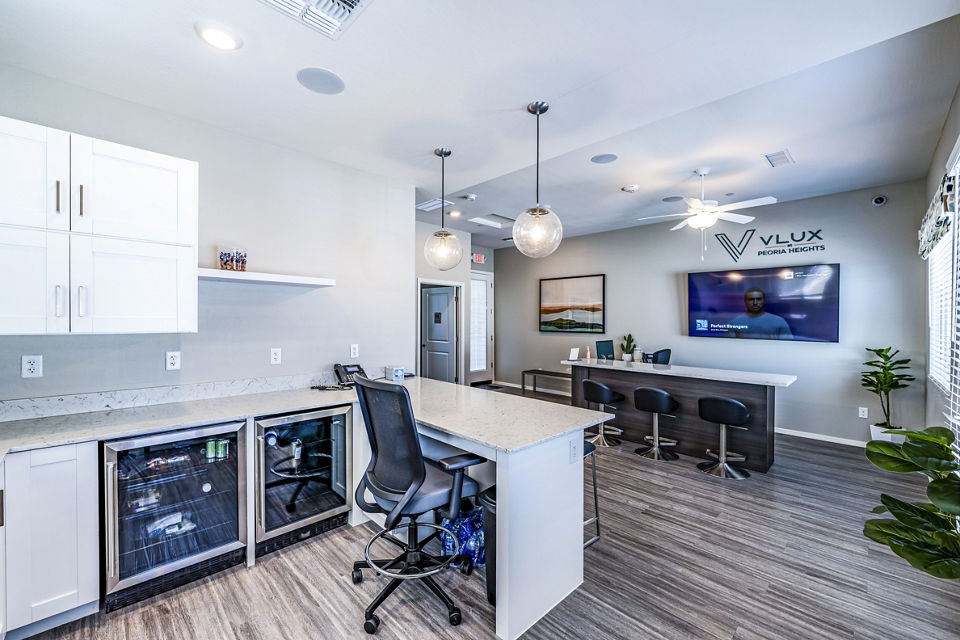 Spacious clubhouse lobby featuring modern decor at Vlux at Queen Creek Apartments