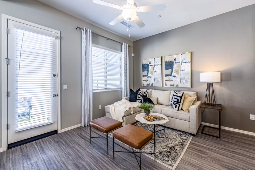Modern living room with plush seating and stylish dÃ©cor at Vlux at Queen Creek Apartments, featuring luxury design elements