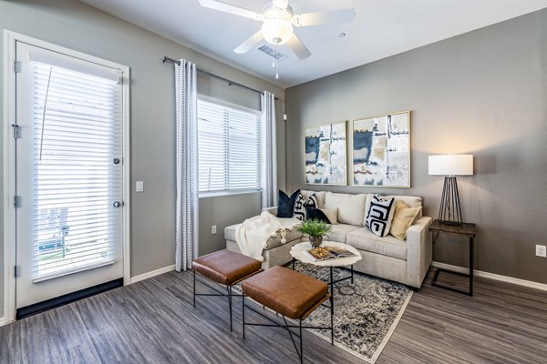 living room at Vlux at Queen Creek Apartments