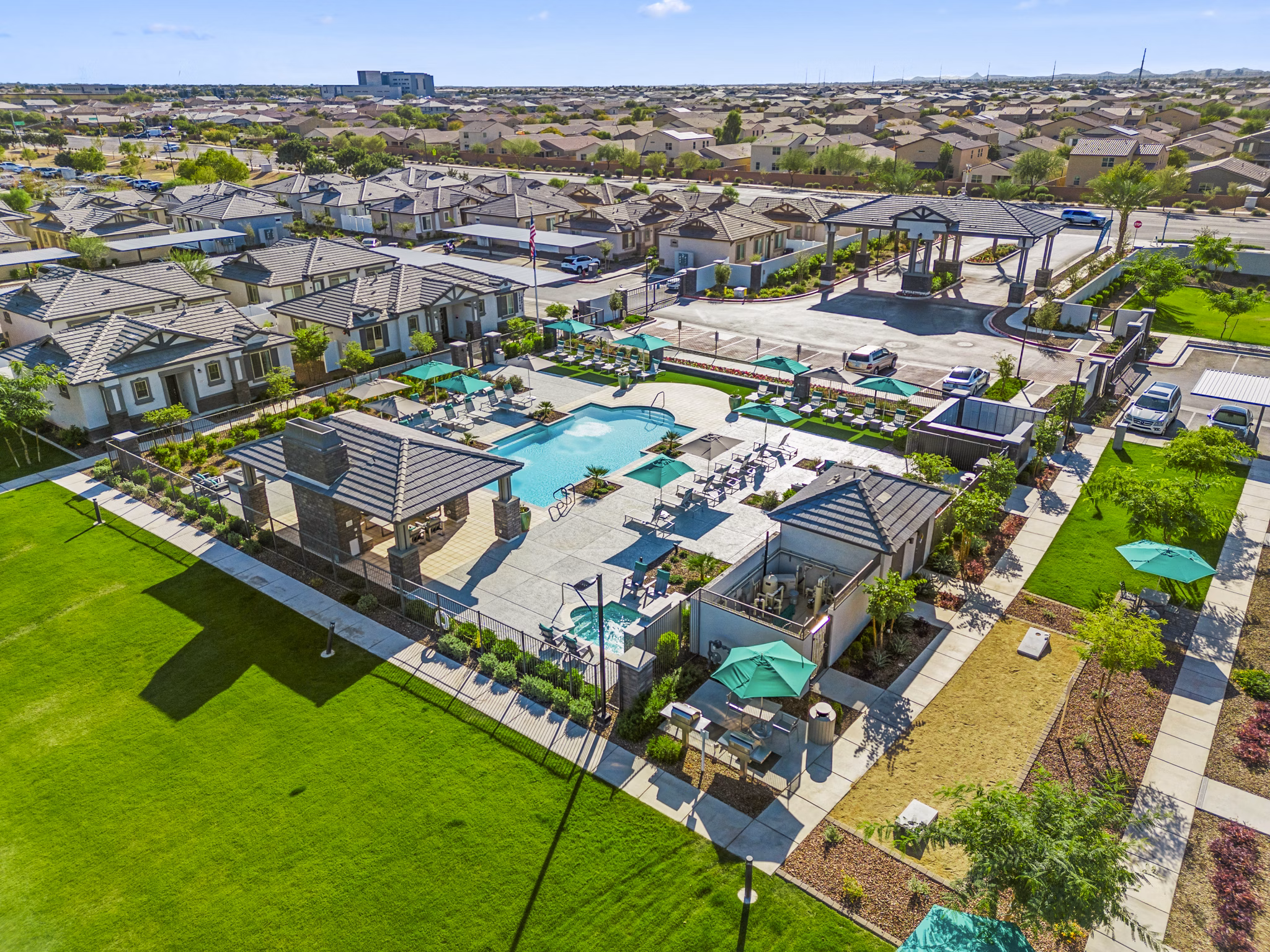 Expansive resort-style pool at Vlux at Queen Creek Apartments, a Greystar luxury community in a vibrant setting