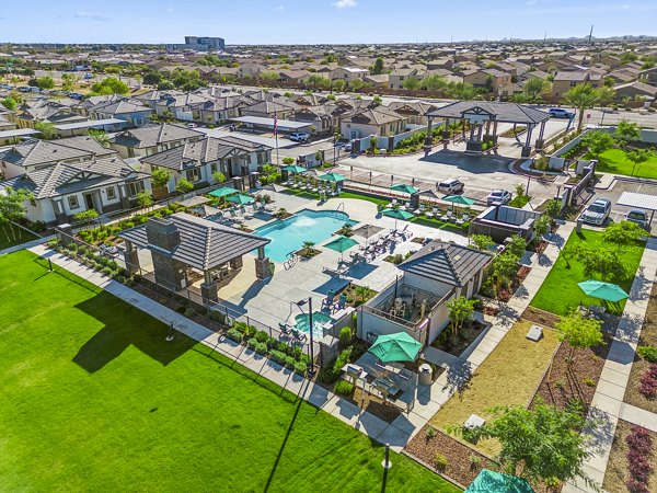 Expansive resort-style pool at Vlux at Queen Creek Apartments, a Greystar luxury community in a vibrant setting